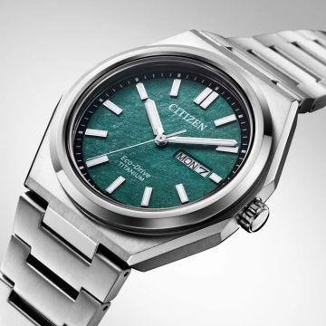 Photo of the Citizen Zenshin Super Titanium 39mm watch AW0130-85X with a striking green dial, lightweight Super Titanium case and bracelet, featuring Eco-Drive technology for continuous power.
