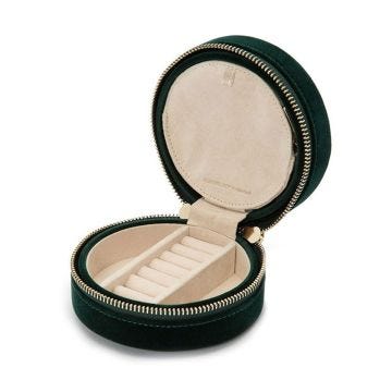 Photo of the WOLF 1834 Zoe Round Zip Case Jewellery Box in forest green, featuring a sleek, round design with a secure zip closure 393212