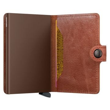 Photo of the Secrid Miniwallet Vintage Cognac Brown (MV-Cognac-Brown). Close-up image of the rich cognac brown wallet, showcasing its vintage leather and secure card storage mechanism.
