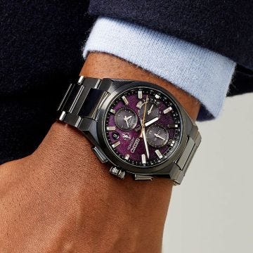 Photo of the Seiko Astron Limited Edition 42mm Purple Dial Solar Titanium Watch (SSH171J1), featuring a bold purple dial and lightweight titanium construction.
