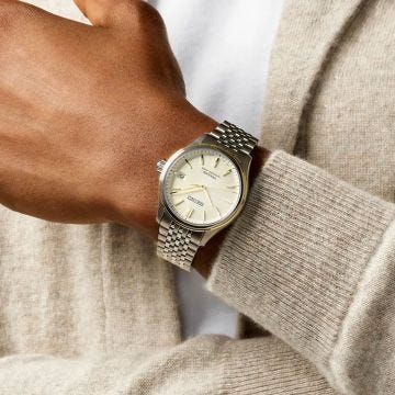 Photo of the Seiko Presage Classic 40mm Cream Dial Automatic Stainless Steel Watch (SPB478J1), featuring a sleek stainless steel case and a vintage-inspired cream dial.