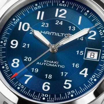 Photo of the Hamilton Khaki Field 38mm Blue Dial Automatic Watch H70455140, featuring a striking blue dial, luminous numerals, and a robust stainless steel bracelet