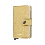 Photo of the Secrid Miniwallet Pebble Butter (MPe-ButterYellow). Close-up image of the butter yellow wallet, showcasing its textured finish and secure card storage mechanism.